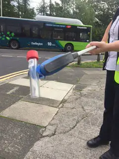 A person holding an air poll